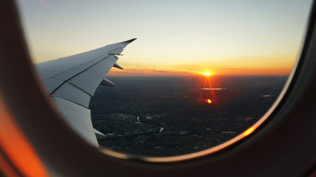 the sight from the window of a plane at sunset